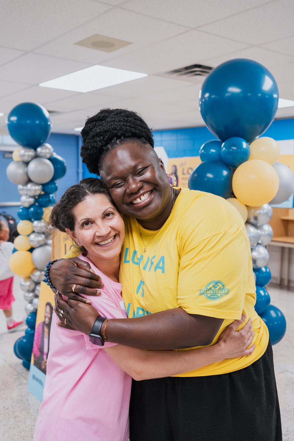 Lohifa Pogoson Acker posing for a photo with Ward 8 community member